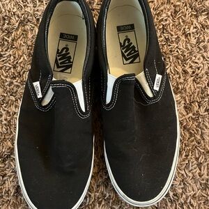 Vans Black and White Slip-On Sneakers